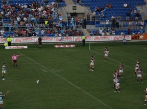 Manly Players look on in disbelief as Scott Prince lines up the conversion to win the Titans the game, after a controversial decision by referee Matt Cecchin