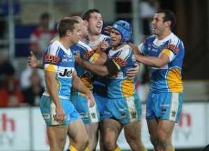 The Titans celebrate their maiden win over the Dragons